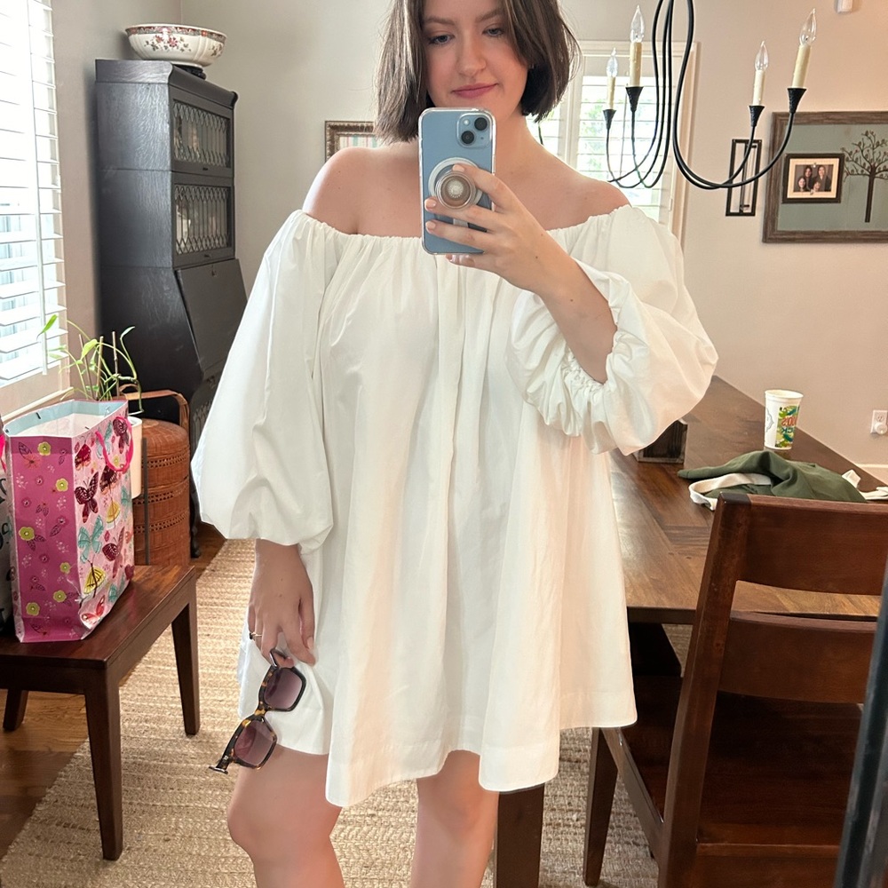 White, off the shoulder puffy sleeve dress perfect for a bridal look.